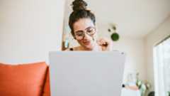 Woman using laptop at home