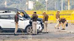 Police personnel conduct investigation in the aftermath of the blast