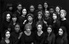 A black and white image of many women of colour grouped together