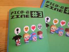 PICO-8 ZINE #3 Two issues of PICO-8 Zine #3 with pixel art characters holding game controllers on a green cover.