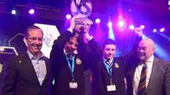 Eric Doyle and Mark Kelly receive their trophy