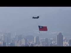 Flag-bearing choppers fly over Taipei in National Day rehearsal