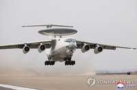 (3rd LD) N. Korea releases photos of what appears to be airborne control aircraft for 1st time
