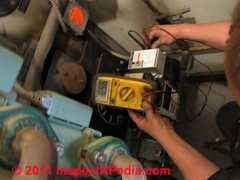 Cad cell check during heating system tuneup © D Friedman at InspectApedia.com 