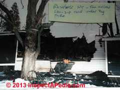 Fire damaged home - electrical cord under carpet (C) Daniel Friedman