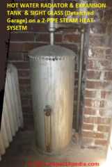 Hot water heat expansion tank and sight glass connected to steam boiler (C) InspectApedia.com TransueL