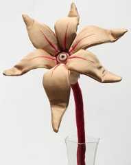 Tara  McPherson -  <strong>The Day's Eye (Gold)</strong> (2010<strong style = 'color:#635a27'></strong>)<bR /> polyester, suede microfiber, bamboo fiber, polyfil, wire and glass eye,  20 x 9 x 6.5 inches (50.8 x 22.86 x 16.51 cm)