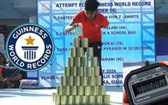 Super fast kid breaks record with can pyramid!