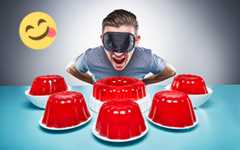 man with blindfold on table with jelly