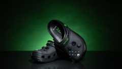 Xbox themed Crocs sit against a green gradient.