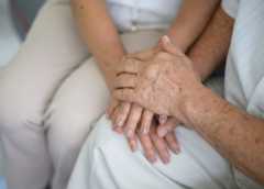 Old people holding hands each other