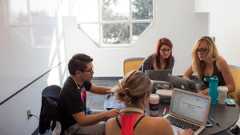 Decorative image showing students sitting in a study room, studying.