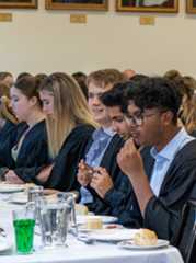 College students eating together.