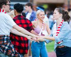 College students celebrating outdoors.