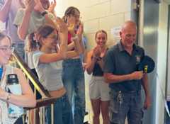 Lincoln college students and property manager celebrating.