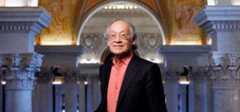 Image of 25th Poet Laureate, Arthur Sze, standing in the Library of Congress Jefferson Building.