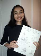 Camille Manet holding her concept art of KP-1