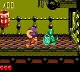 Dixie Kong holding a Steel Barrel at a Koin in Karbine Kaos in Donkey Kong GB: Dinky Kong & Dixie Kong