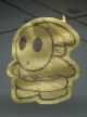 A Gold Shy Guy from Paper Mario: Color Splash.