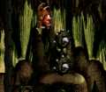 Donkey Kong and Diddy Kong attempt to jump over two Mincers in Manic Mincers of Donkey Kong Country
