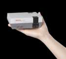 Hand holding NES Classic Edition as scale