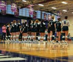 The Raptors stand for the national anthem prior to their match against Anne Arundel Community College. Photo taken by