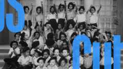Children of the Black Panther Party raise their hands for a school photo.