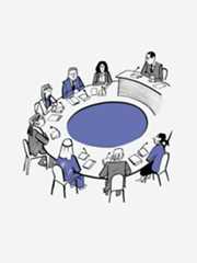 Men and women gathered around a circular conference table.