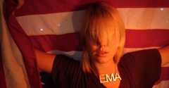 Image may contain Symbol Flag Human and Person