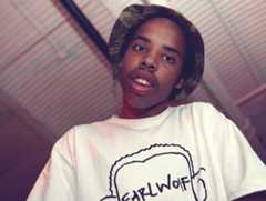 Image may contain Earl Sweatshirt Clothing Apparel Face Human Person TShirt Smile Photo Portrait and Photography