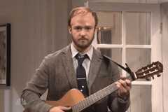 Image may contain Human Person Leisure Activities Justin Timberlake Musical Instrument Guitar and Bass Guitar
