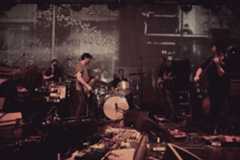 Image may contain Musical Instrument Musician Human Person Percussion Drummer Guitar Leisure Activities and Crowd