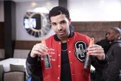 Image may contain Drake Human Person Worker and Bartender