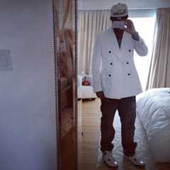 Image may contain Coat Clothing Apparel Footwear Shoe Human Person Overcoat Suit Blazer and Jacket