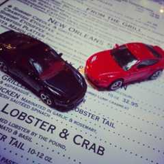 Image may contain Text Transportation Vehicle Car Automobile Wheel and Machine