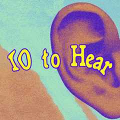 Man in glasses flipping through crate of vinyl