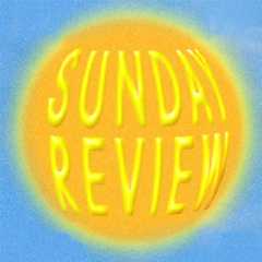 Masked Björk singing into a microphone