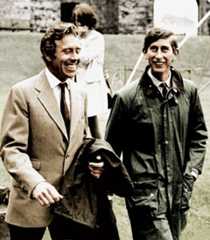 Image may contain Clothing Apparel Human Person Tie Accessories Accessory Coat Jacket and People