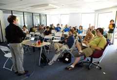 Image may contain Human Person Furniture Chair Indoors Room School and Classroom