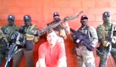 El Cholo surrounded by CJNG hitmen.