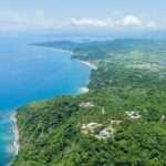 Aerial view of lo de marcos, nayarit, mexico, showcasing the stunning coastline, crystal-clear turquoise waters, sandy beach, and lush green vegetation