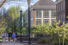 students walking outside of Pearson Hall in campus