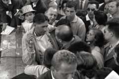 Jack Brabham talks with with a young autograph hunter.