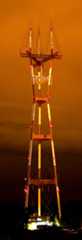 Sutro Tower at night under an orange illuminated sky