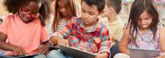 Kindergarteners on tablets.