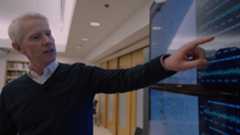 Berkeley Seismological Laboratory director Richard Allen points at a chart on a screen.