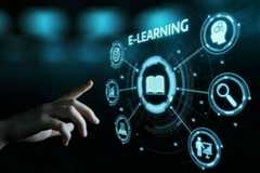 A hand points to a glowing blue E-LEARNING interface. In the center, an open book icon is surrounded by other digital icons for learning concepts: target, graphs, video, presentation, search, and a head with gears.