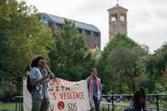 Ebtesham Ahmed leads a chant during rally in Garibaldi Plaza (Alex Woodworth for WSN)