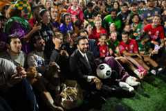 Zohran Mamdani posing for a photo with players and fans at the end of the Classic. (Evan D’Souza for WSN)