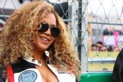 Beyoncés neckline opened after she felt the rush of speed from Lewis Hamiltons car